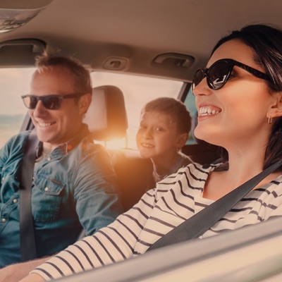 Young Family Driving in Florida